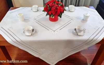 Exclusive hand-embroidered tablecloth.