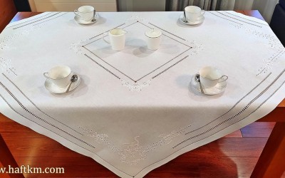 Exclusive hand-embroidered tablecloth.