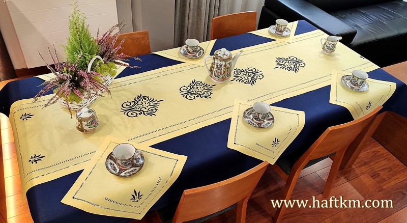 Luxurious, hand-embroidered linen tablecloth.