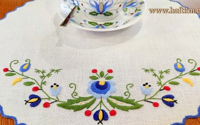 Hand-embroidered linen tablecloth with a Kashubian motif.