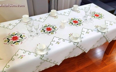 Tablecloth hand embroidered with a Christmas motif.