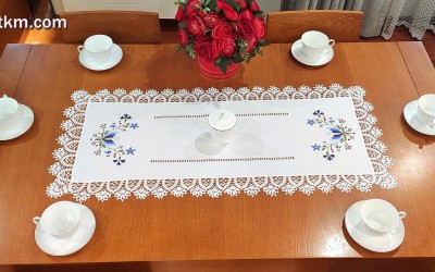 A beautiful hand-embroidered table runner with a Kashubian motif.