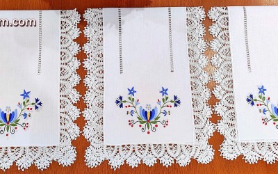 A beautiful hand-embroidered table runner with a Kashubian motif.